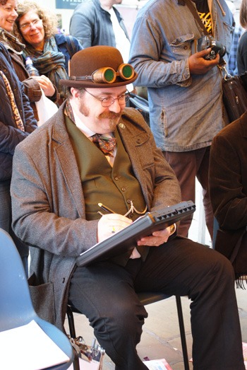 Alex Hughes, steampunk caricaturist outfit was enough to, er, draw a crowd