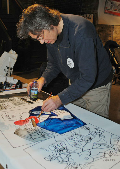 Andy Davey works on the Procartoonists team banner