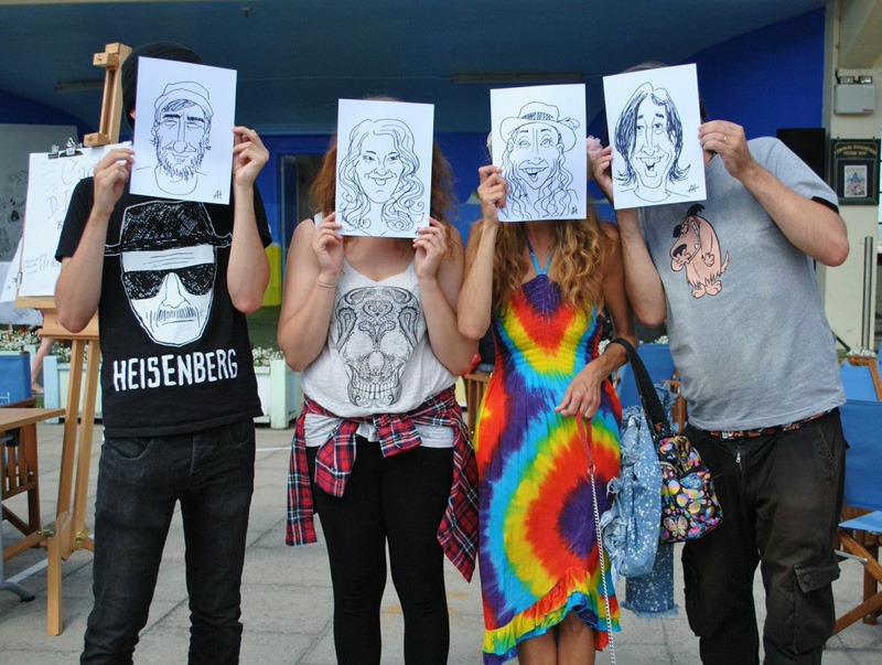 Happy caricature subjects, we assume, drawn by Alex Hughes. Photo © Kasia Kowalska