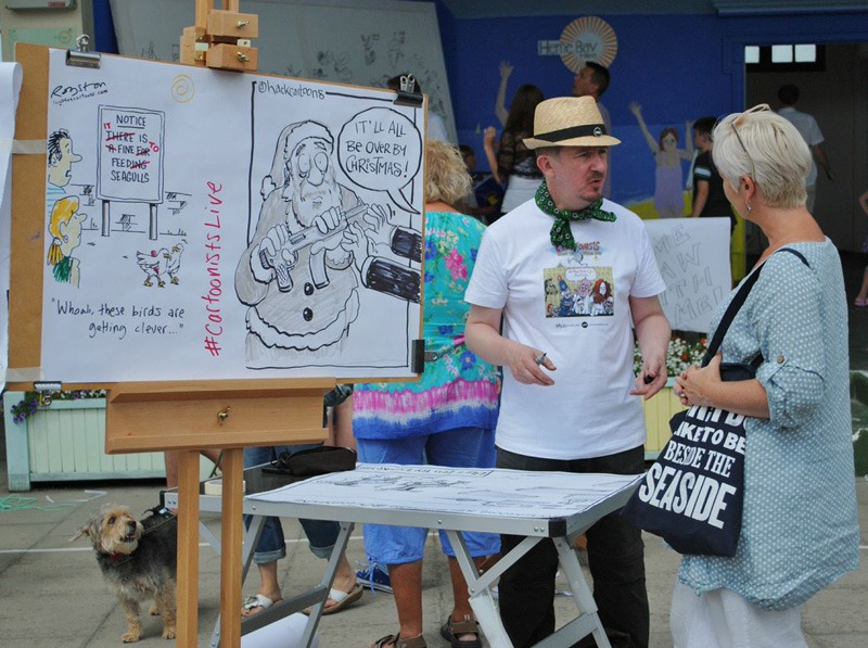 The public very very willing to chat and discuss the drawings Matt Buck talks cartoons. Photo © Kasia Kowalska