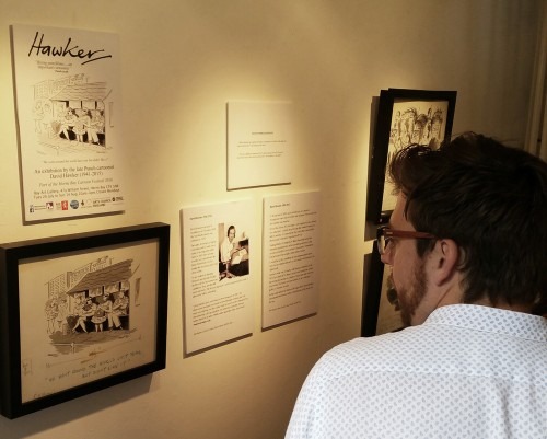 Cartoonist Rob Murray takes in the exhibition by the late David Hawker