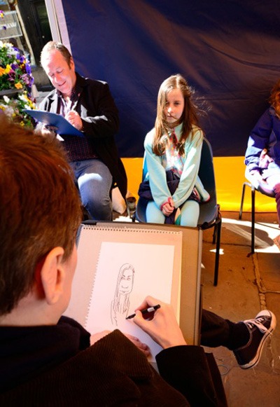 Nice day for caricatures. Jonathan Cusick (front) and Tim Leatherbarrow in action