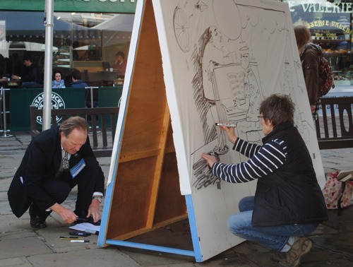 Andrew Birch and Kate Charlesworth at work on their Big Boards, the most high-profile element of the festival. They're hard to miss.