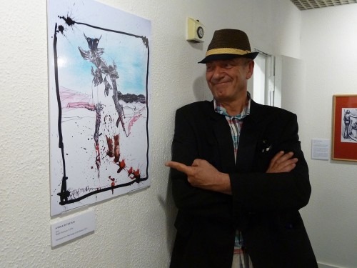 Steve Coombes at the Outrage! exhibition with Ralph Steadman's cartoon. Photo © Steve Coombes
